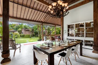 a dining room with a large table and chairs at Villa Kuda Sumba by BaliSuperHost in Kerobokan