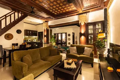 a living room with a couch and a table at PROMO Uniquely Styled Spacious 3bd Villa in Kerobokan