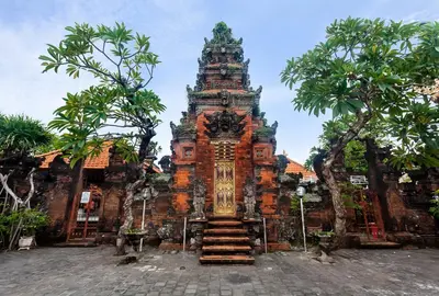 a large building with a tower in front of it at Ghana Villa Seminyak by GenuineHost in Seminyak