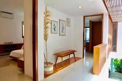 a bedroom with a bed and a bench in a room at Spacious 2 BR Private Pool Villa ZN108 in Seminyak