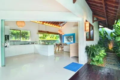 a kitchen and dining area of a house at Kamila Aranne 3 BR Private Pool Villa in Jimbaran