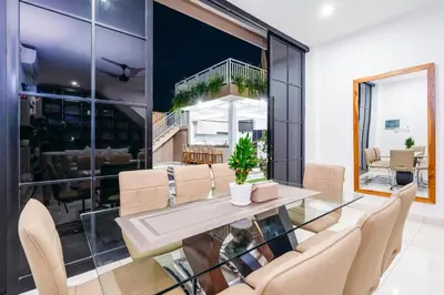 a dining room with a glass table and chairs at Villa Crystal 9b in Seminyak