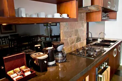 a kitchen with a stove and a counter top at Dean 2 BR Private Pool Villa in Jimbaran