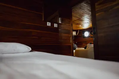 a close up of a bed in a room at Floating Hotel SALTWATER COWBOYS in Kuta