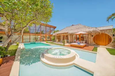 an exterior view of a house with a swimming pool at Villa Vienna - New 8BDR Jacuzzi Sauna and Cinema in Seminyak