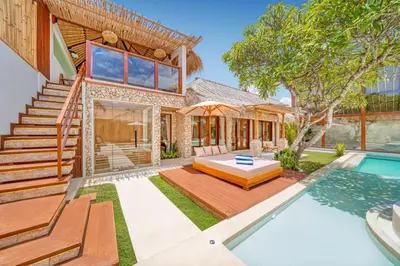 an exterior view of a house with a swimming pool at Villa Vienna - New 8BDR Jacuzzi Sauna and Cinema in Seminyak