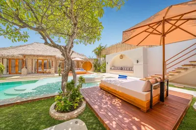 a bedroom in a villa with a swimming pool at Villa Vienna - New 8BDR Jacuzzi Sauna and Cinema in Seminyak