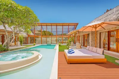 a house with a swimming pool and a bed in the yard at Villa Vienna - New 8BDR Jacuzzi Sauna and Cinema in Seminyak