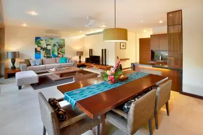 a living room with a dining table and a kitchen at Amani Entire 2 BR Private Pool Villa in Seminyak