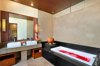 a bathroom with two sinks and a large bath tub at Amani Entire 2 BR Private Pool Villa in Seminyak