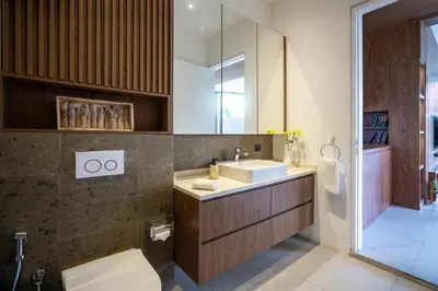 a bathroom with a sink and a toilet at Umalas Creek Villas in Canggu