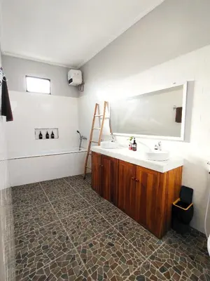 a bathroom with a sink and a mirror at Peaceful Private 4 BR YY Bali Villa, Jimbaran Nusa Dua, In Central Kuta in Jimbaran