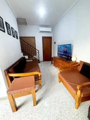 a living room with two couches and a flat screen tv at Peaceful Private 4 BR YY Bali Villa, Jimbaran Nusa Dua, In Central Kuta in Jimbaran