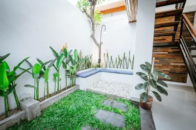 a courtyard with plants in a house at Villa Umah Seminyak in Seminyak