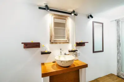 a bathroom with a bowl sink and a mirror at Villa Laksmana 1 in Canggu