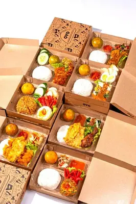 a group of boxes filled with different types of food at Collection O Near Seminyak Beach Formerly The Kumpi Hotel in Seminyak