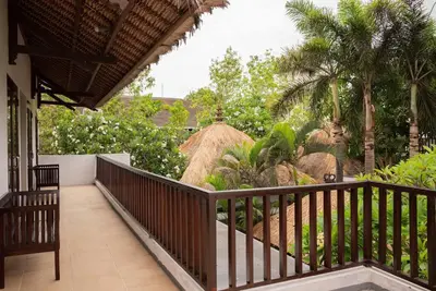 a balcony with a view of a resort at Balinese stile villa in Nusa Dua
