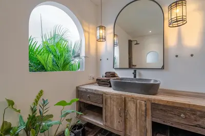 a bathroom with a sink and a mirror at Villa Casa Eldorado by BaliSuperHost in Kerobokan