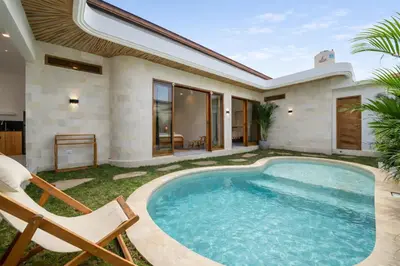 a swimming pool in the backyard of a villa at Nooky 1 - 2BR Villa with HUGE Pool in Kerobokan