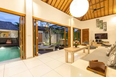 an open living room with a pool in a villa at Luxurious and Cozy King Beds, Pool, closed living room in Kuta