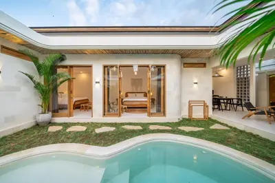 a pool in the backyard of a villa at Nooky 2 - PROMO Seminyak - 2 BDR - Brand NEW Villa - HUGE Pool in Kerobokan