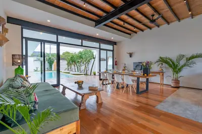 a living room with a couch and a table at Villa Wamwui by DreamAwayBali in Seminyak