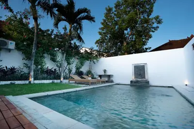 a swimming pool in the backyard of a house at Villa Isla Bali in Seminyak