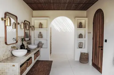 a bathroom with two sinks and a mirror at Villa Almaz Seminyak in Seminyak