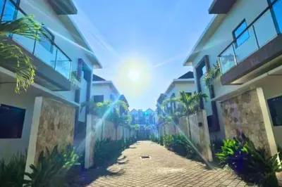 a view of a street between two buildings at Adaline 2 BR Apartment in Jimbaran