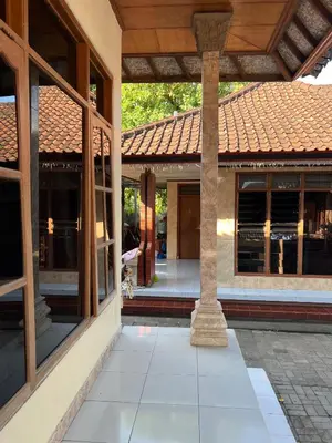 an external view of a house with a tile roof at Pondok Ledog 02 in Jimbaran