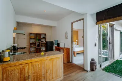 a kitchen with a sink and a counter top at Cozy & Private 1 Bed Pool Villa in Trendy Umalas in Kerobokan