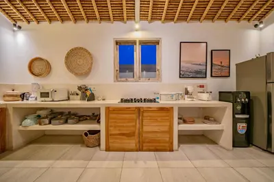 a kitchen with wooden cabinets and a counter top at Villa Antea in Seminyak
