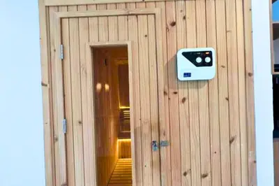 a wooden building with a door with a camera on it at Abimana 5 BR Presidential Suite Private Pool in Jimbaran