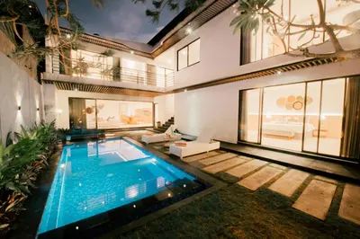 a swimming pool in the backyard of a house at Seminyak Villa Luxury 4BR near Beach Lafavela in Seminyak