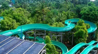 an aerial view of a water slide in the forest at OYO Life 92852 Singgah Hotel Legian in Legian