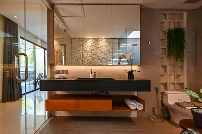 a bathroom with a sink and a toilet at The Cabana Villa in Seminyak