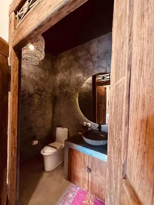 a bathroom with a sink and a toilet at Villa Pisces - 2 Bedrooms Villa with Private Pool at Kerobokan in Denpasar