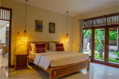 a bedroom with a bed in a room at Atres Griya Villa 5 Private Bedroom Kuta in Kuta