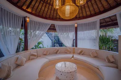 a living room with a couch and a table at Villa Coconut Heaven by Bali Villa Solutions in Seminyak