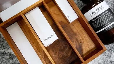 a wooden box with two windows and a bottle of wine at Villa Latima by Villa Finder in Seminyak