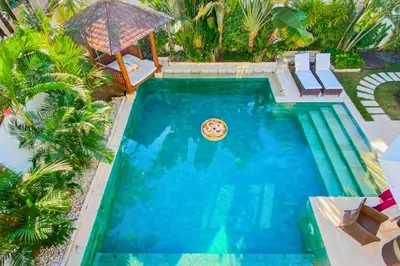 an overhead view of a swimming pool with a pizza in it at Chandani 3 BR Private Pool Villa in Ujung