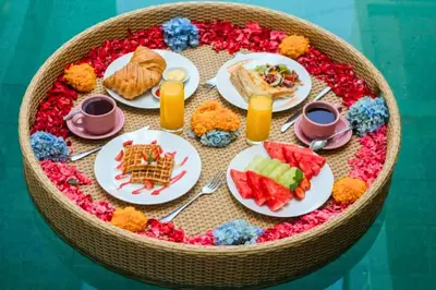 a table with plates of food on a table at Chetana 2 BR Private Pool Villa in Ujung
