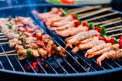 a bunch of meat and vegetables on a grill at Charvi 1 BR Private Pool Villa in Ujung