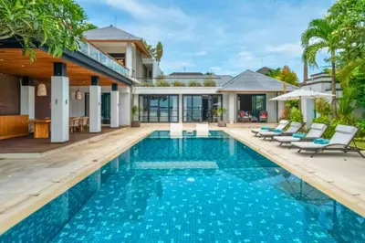 a swimming pool in the backyard of a villa at Chayanika 4 BR Private Pool Villa With Sea View in Ujung
