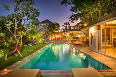 a swimming pool in the backyard of a house at Janardana 4 BR Private Pool Villa ZN157 in Canggu