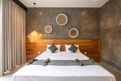 a bedroom with a large white bed in a room at Minimalist Villa with Pool #Nico1 in Canggu