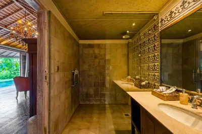 a bathroom with two sinks and a large mirror at Janya 3 BR Private Pool Villa ZN158 in Canggu