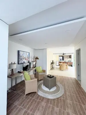 a living room with a couch and a table at 3 Bedroom Calla Villa in Nusa Dua