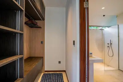 a bathroom with a shower and a walk in closet at Villa NUSA - 3BR Villa in Umalas next to Nook in Kerobokan