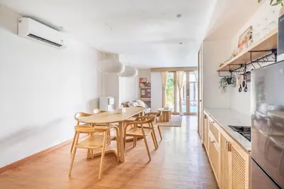 a kitchen and dining room with a table and chairs at IRMAS Villa Bali in Seminyak